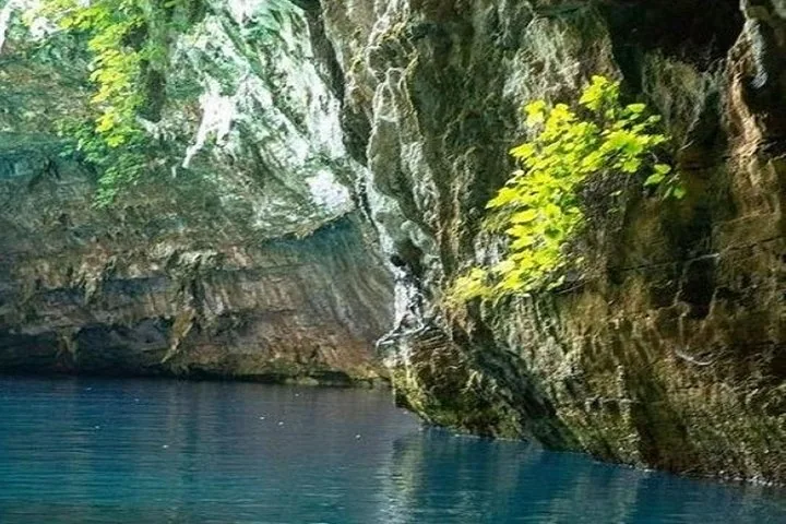 Crystal clear blue waters inside the breathtaking Melissani Cave.